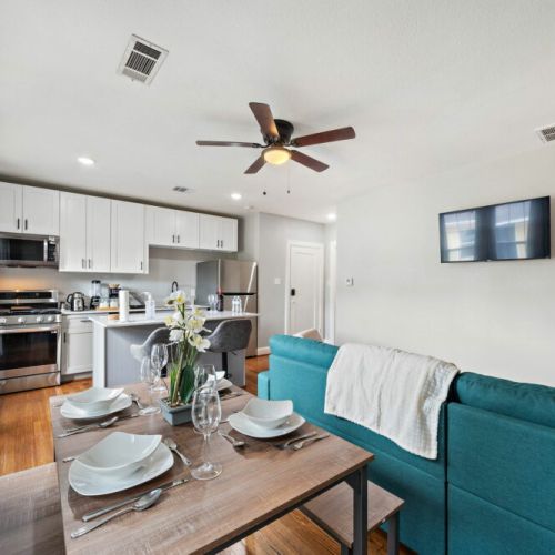 Spacious dining table that sits 4 with full tableware and silverware included.