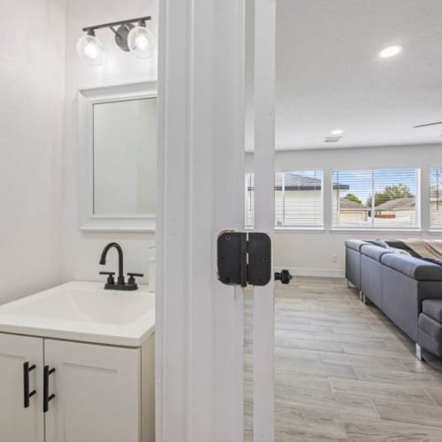 Half bath adjacent to dining room for maximum convenience.