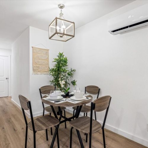 Charming dining table that sits 4 with full tableware and silverware included.