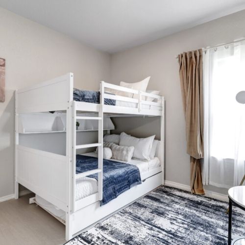 4th bedroom with 1 twin size bed and 2 full size beds (triple bunk bed).