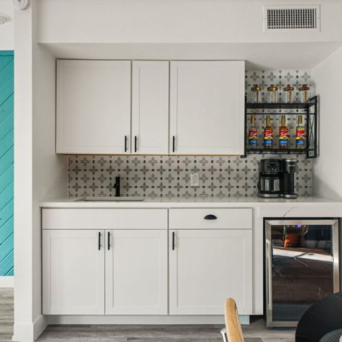 Coffee bar and wine fridge included.