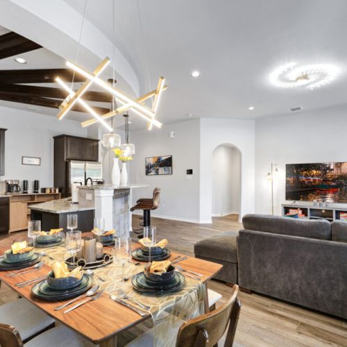 Spacious dining table that sits 6 with full tableware and silverware included.