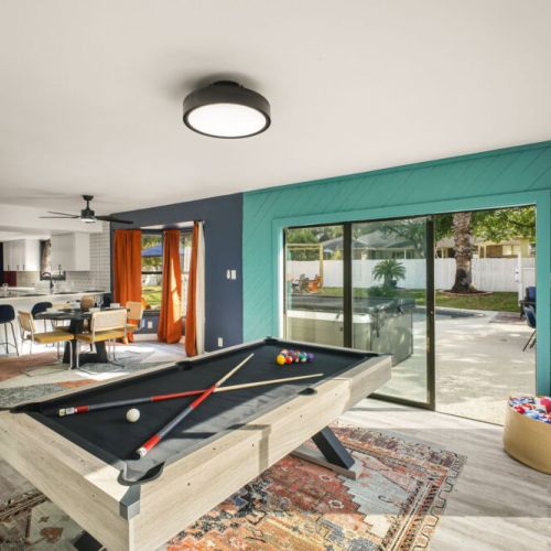 Challenge your group to a game of pool while enjoying beautiful views of the backyard.