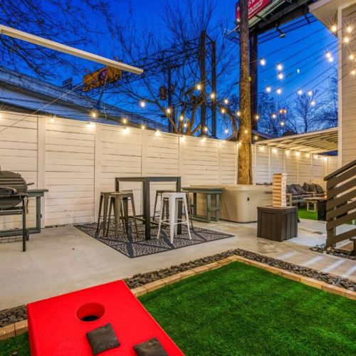 Private patio with a charming patio seating. We also include a grill and a cornhole set!