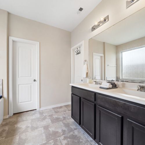 Primary bathroom is fully stocked with all you need. Makeup pads and q-tips included.