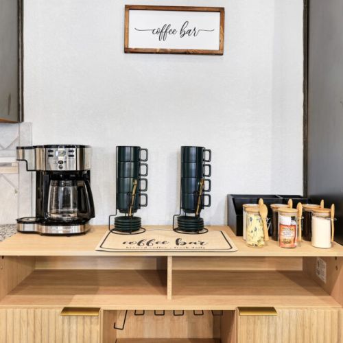 2-Way drip coffee machine with complimentary coffee,  decaf, tea, sugar, cream, and sweetener.