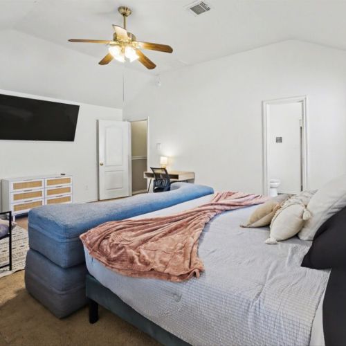 Smart TV, seating area and workspace included.