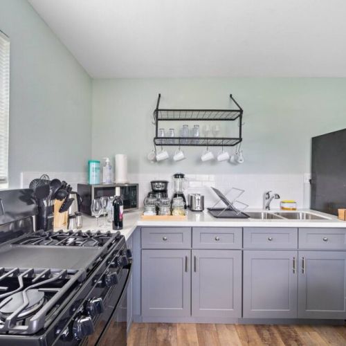 Fully equipped kitchen from house at the back.