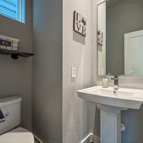 Half bath in next to the kitchen for maximum convenience.