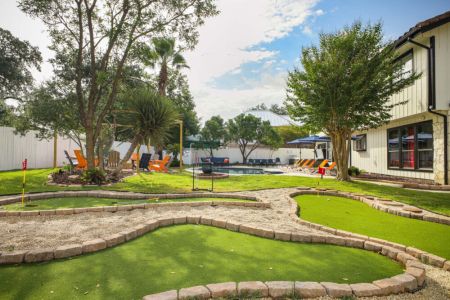 Enjoy a round of mini golf surrounded by the spacious backyard and resort-style amenities.
