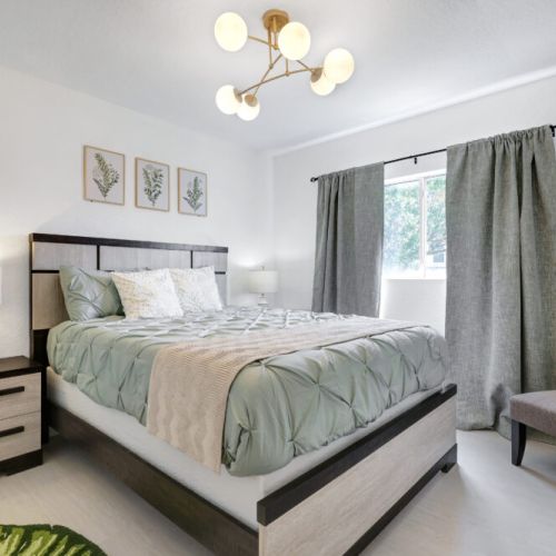 2nd bedroom with queen size bed. Plus, we included an accent chair for your comfort.